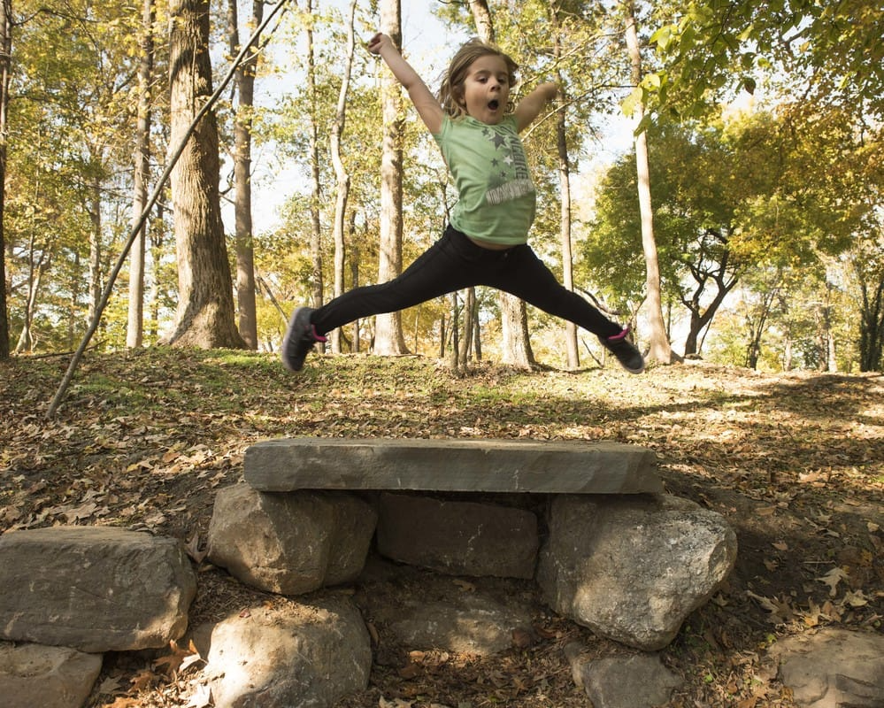 Child Jumping off Rock